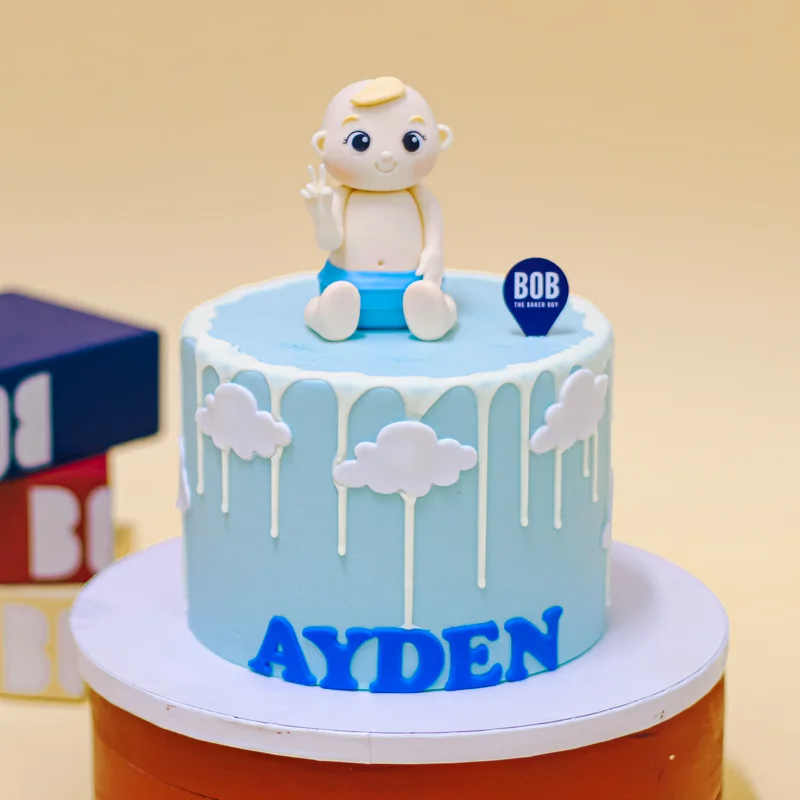 Pastel Blue Cake with Baby Figurine