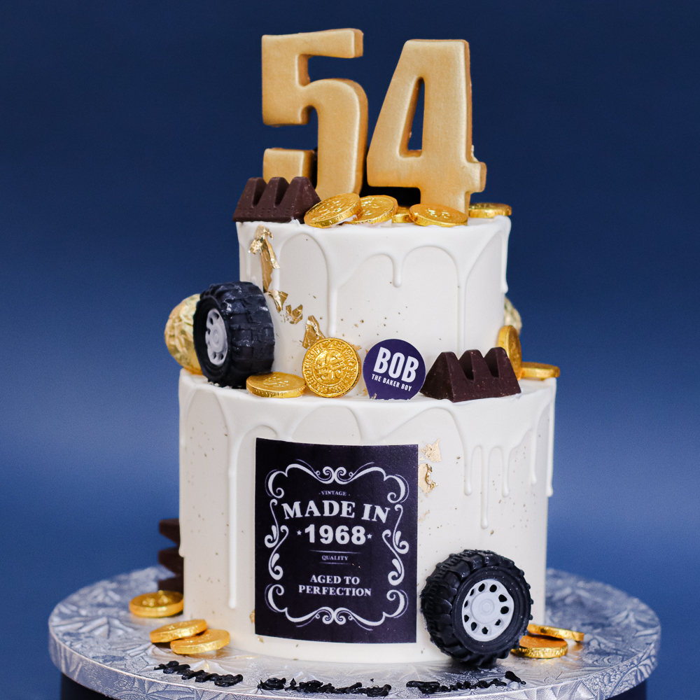 Wheels and Gold Bars Cake in Classy White