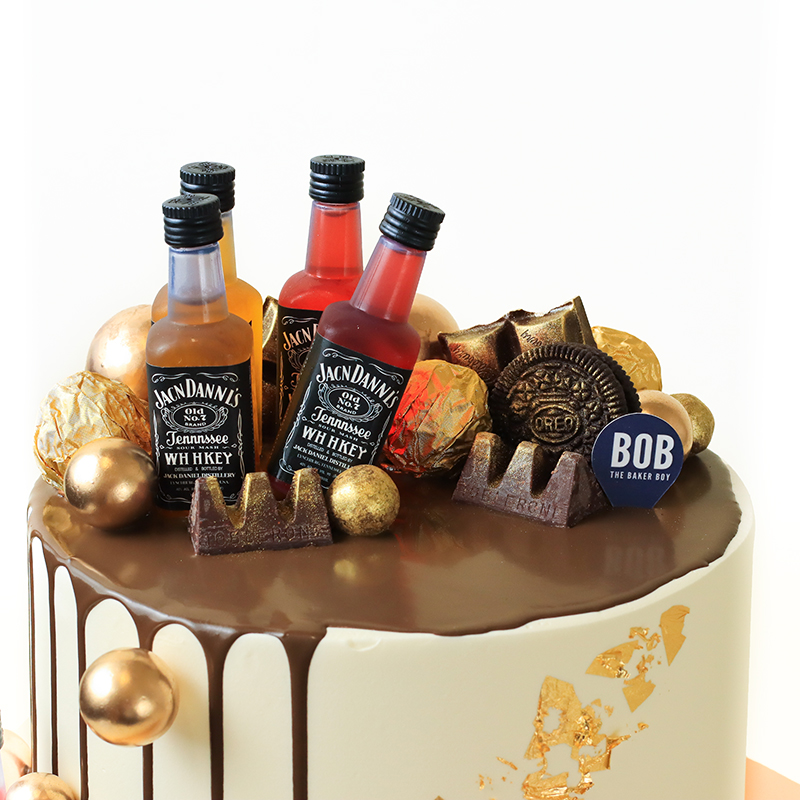 Whiskey Liquor Cake with Gold Ornaments and Drip
