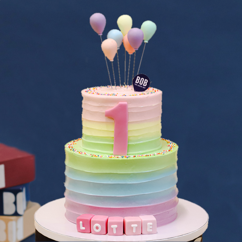 Pastel Rainbow Swirls with Balloons and Name Cubes