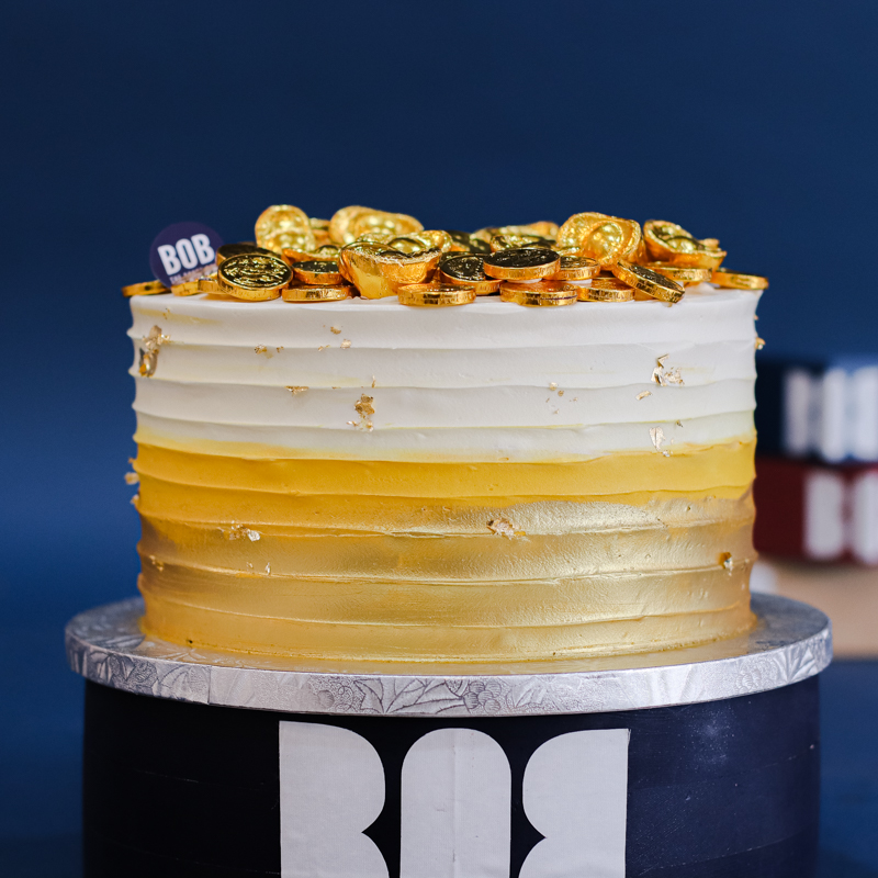 Gold Ombre Cake with Gold Bars and Coins