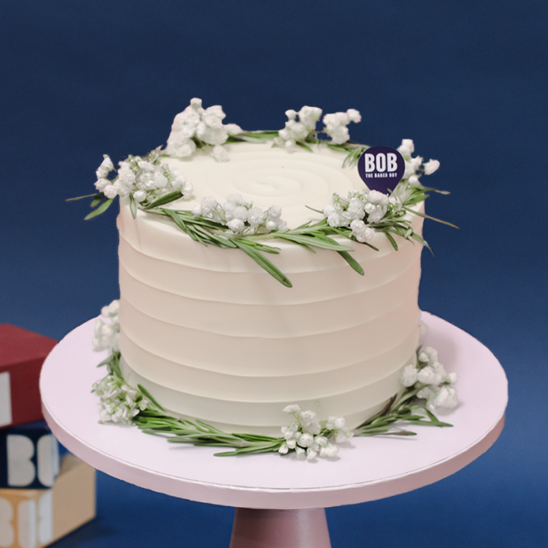 White Swirl Cake with Rosemary and Babies Breath