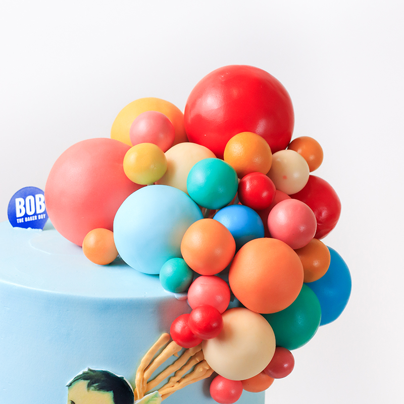 Little Toddler and Rainbow Balloons Cake