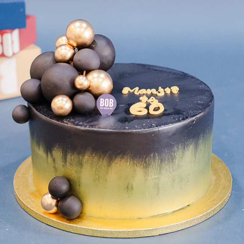 Extravagant Black and Gold Cake with Gold Balls