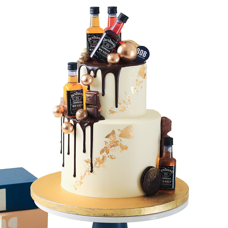 Whiskey Liquor Cake with Gold Ornaments and Drip